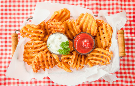 Fresh waffle fries with ketchup and mayonnaiseの写真素材