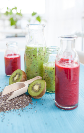 Green and red smoothies with kiwi and chia seedsの写真素材