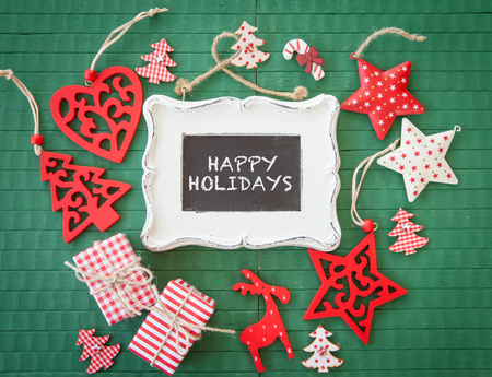 Colorful christmas decorations on green wooden backgroundの写真素材