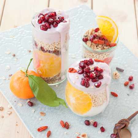 Different cereals with yoghurt and fresh fruitsの写真素材