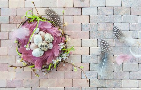 Colorful easter decorations on a marbled stone backgroundの写真素材