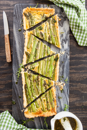 Homemade shortcrust quiche made with green asparagusの写真素材