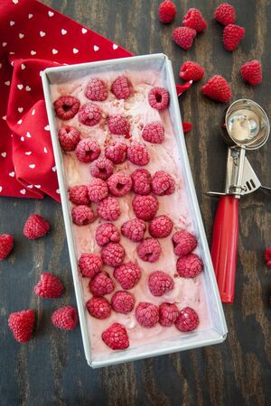 Homemade raspberry ice cream with fresh berries