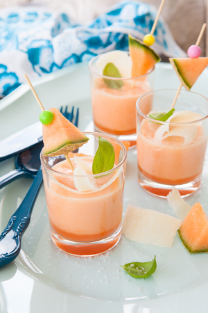 Chilled soup made from cantaloupe melon with parmesan cheeseの写真素材