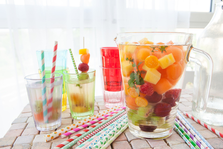 Homemade fruit punch with colorful fruits and mintの写真素材