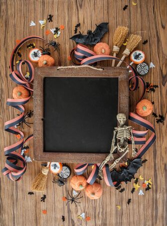 Colorful Halloween background with decorations and candyの写真素材