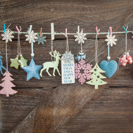 Rustic wooden christmas background with festive ornamentsの写真素材