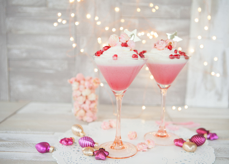 Raspberry panna cotta with a white mousse au chocolat and pink popcornの写真素材
