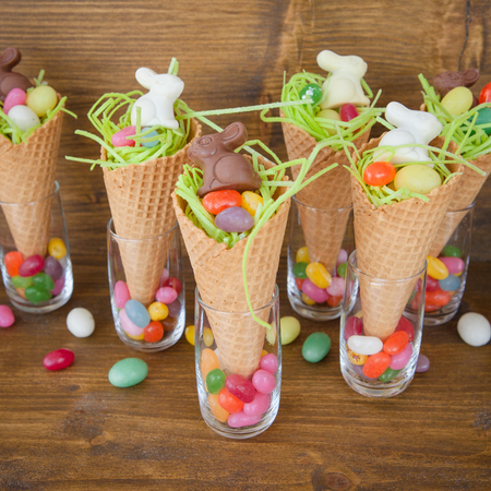 Little easter nests with candy in waffle cones