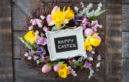 Decorative wreath made from twigs and flowers for easterの写真素材