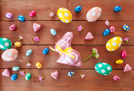 Colorful easter eggs and chocolate bunny for a happy easterの写真素材