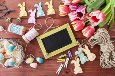 Cheerful decoration for easter on a rustic wooden background