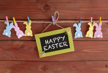 Cheerful decoration for easter on a rustic wooden backgroundの写真素材