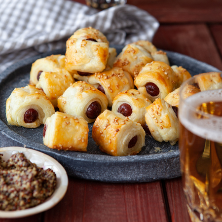 Savoury snack with puff pastry and sausages / pigs in a blanketの写真素材