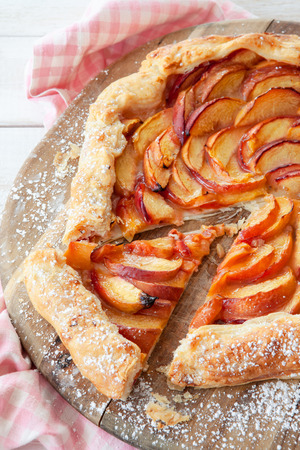 Homemade peach pie made with flakey puff pastryの写真素材