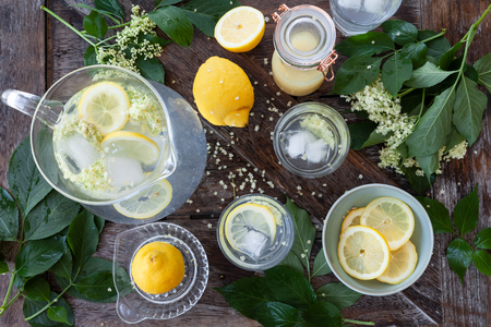 Homemade lemonade made with elderflower sirup and slices of lemonの写真素材