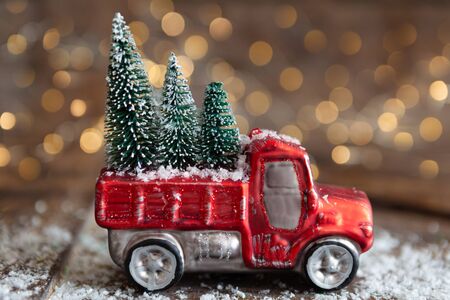 Christmas ornament on wooden background with bokeh lightsの写真素材
