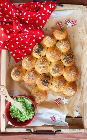 Crispy homemade bread rolls in shape of a Christmas treeの写真素材