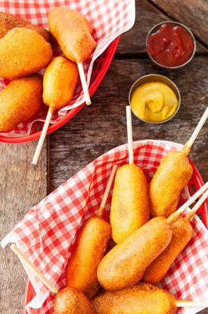 Corn Dogs, little deep fried sausages on sticksの写真素材