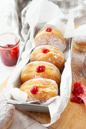 Delicious German donuts filled with jam and powderd sugarの写真素材
