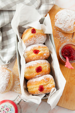 Delicious German donuts filled with jam and powderd sugarの写真素材