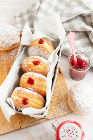 Delicious German donuts filled with jam and powderd sugarの写真素材