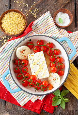 Feta cheese with fresh vine tomatoes and garlicの写真素材