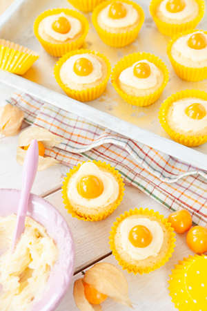 Little cupcakes looking like fried eggs, sunny side up, for Easterの写真素材