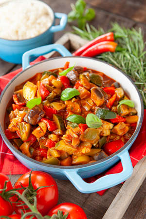 Delicious ratatouille with fresh vegetables and herbsの写真素材