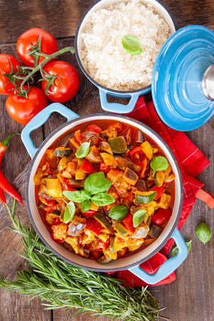 Delicious ratatouille with fresh vegetables and herbsの写真素材
