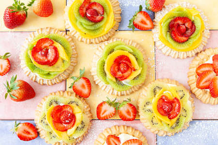 Little shortcrust pies / cakes with fresh fruitsの写真素材