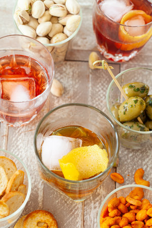 Alcoholic drinks, cocktails on ice and salty snack, appetizersの写真素材