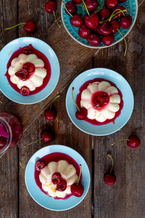 Panna Cotta with fresh cherries and cherry sauceの写真素材