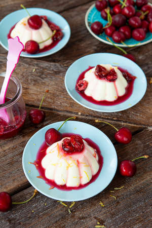 Panna Cotta with fresh cherries and cherry sauceの写真素材