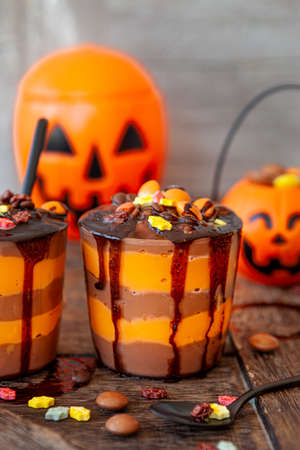 Colorful pudding dessert with sugar sprinkles for Halloweenの写真素材