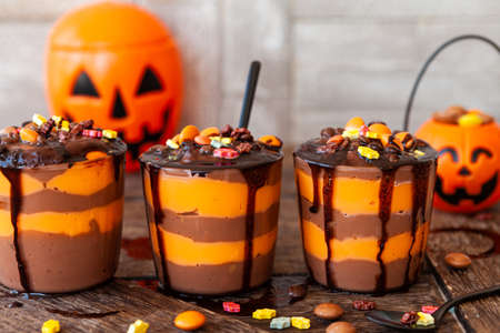 Colorful pudding dessert with sugar sprinkles for Halloweenの写真素材