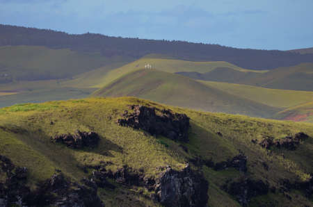 Three little white crosses on the top of the hill seen from Rano Kau volcano at Easter Island