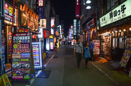 Night walk through the narrow Tokyo streets of Ginza district and its small restaurants