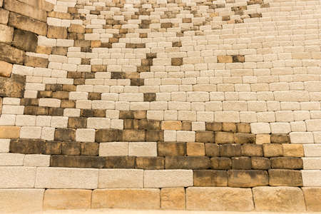 Side wall of the Sungnyemun gate, made of big bricks of stone. Seoul, South Korea.