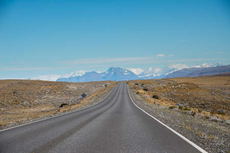 A long road crossing the border of Utah, USA, and Argentinaの写真素材