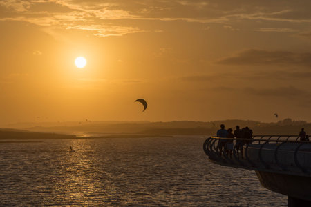 Lots of kite surfers enjoying the first sunset of 2016 at GarzÃÂ³n Lagoon, Maldonado, Uruguay.の写真素材