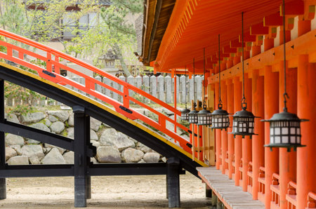 Lanterns and wooden bridge at the main temple of Itsukushima Shrine in Miyajima, Japanのeditorial素材