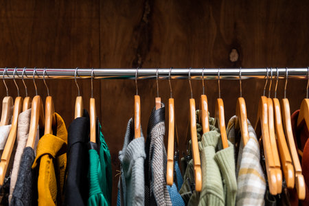 Clothes on hangers in clothing boutique.の写真素材