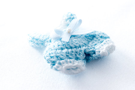 Crochet baby clothes as souvenirs for a first year birthday partyの写真素材