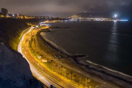 Night view of the ravines and streets against the Pacific Ocean, seen from the Miraflores area, Lima, Peruの写真素材