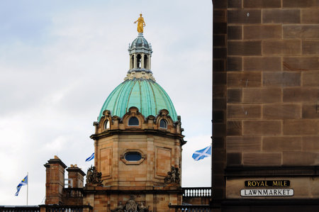 Historic Edinburgh architecture with domed building and Royal Mile street signの写真素材