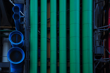 Colorful industrial pipes and structures creating a vivid urban scene in a cityの写真素材
