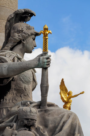 Paris, Ille de France, France. September 16, 2024: A close-up of the Statue of Athena with golden details at Pont Alexandre III in Paris, France.の写真素材