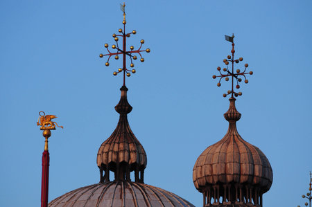 Ornate domes under blue sky highlighting intricate architectural beautyの写真素材