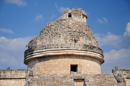 Chichen Itza, Quintana Roo, Mexico. June 01, 2011: Ancient Observatory at Chichen Itza under a clear blue sky.の写真素材
